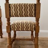 Pair of wooden chairs with herringbone fabric