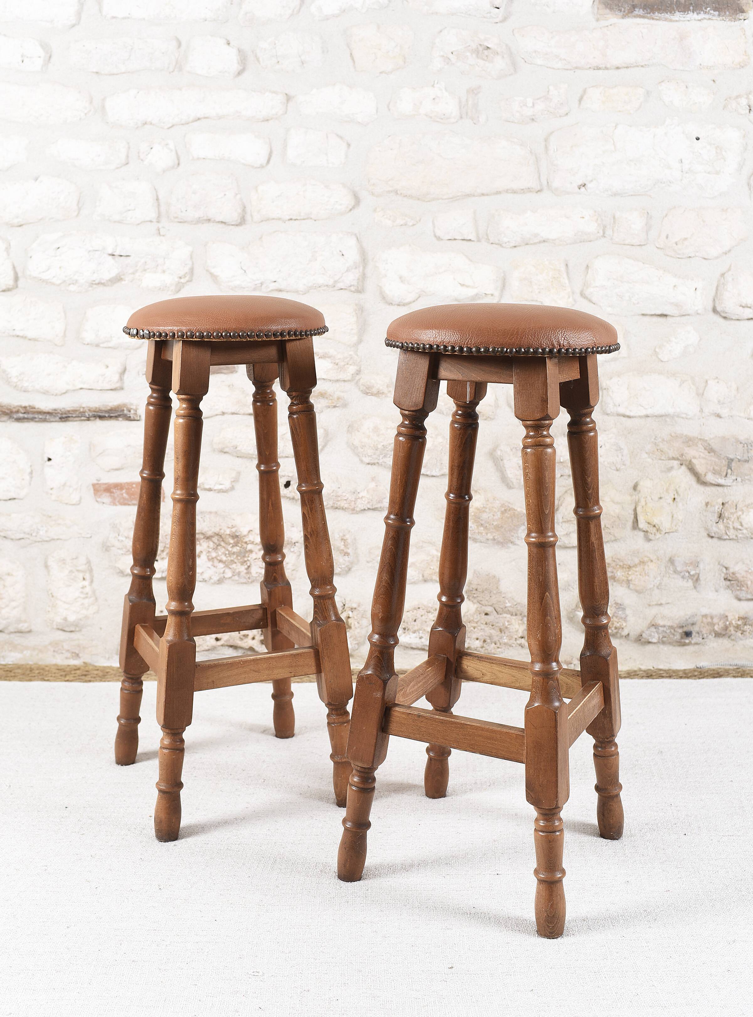 Antique bar stools, brown leather and wood