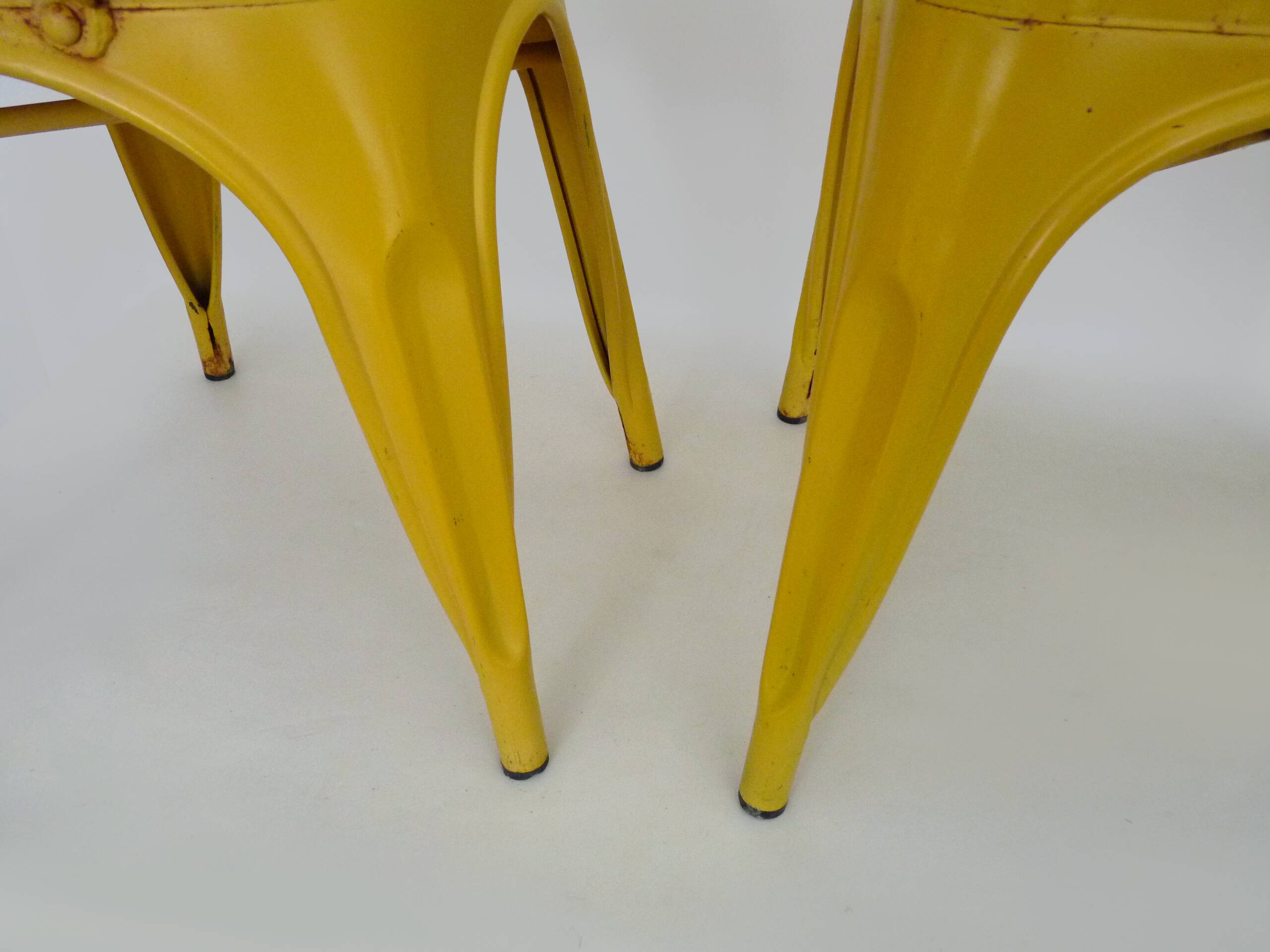Pair of Tolix Chairs in yellow metal by Xavier Pauchard