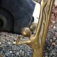 Art Nouveau mirror in gilded brass with a woman figure emerging from a vintage frame
