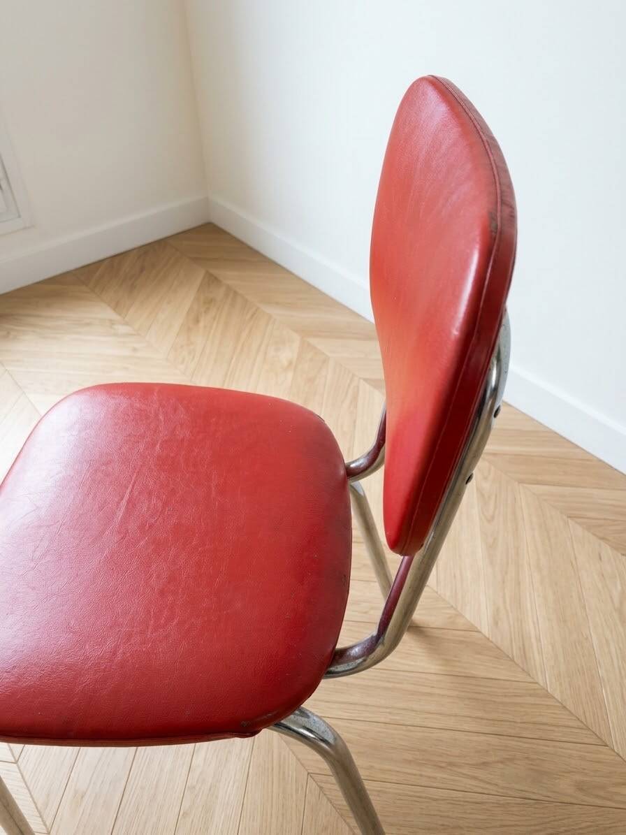 Set of 9 vintage retro chairs in red faux leather.