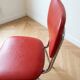 Set of 9 vintage retro chairs in red faux leather.