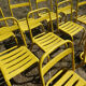 Lot of 11 yellow metallic bistro chairs from the 1950s