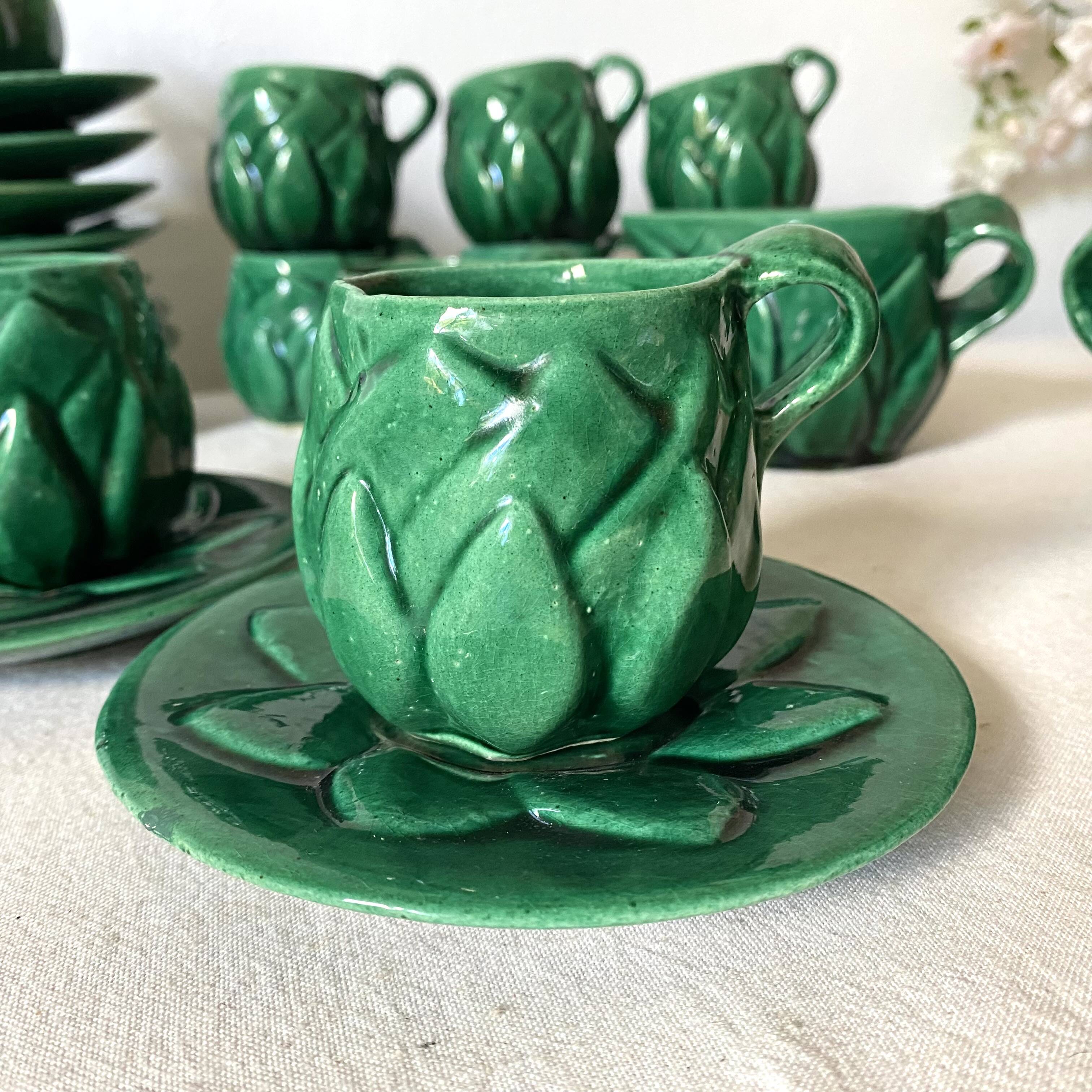 Antique slip cups with saucers, sugar bowl and milk pitcher