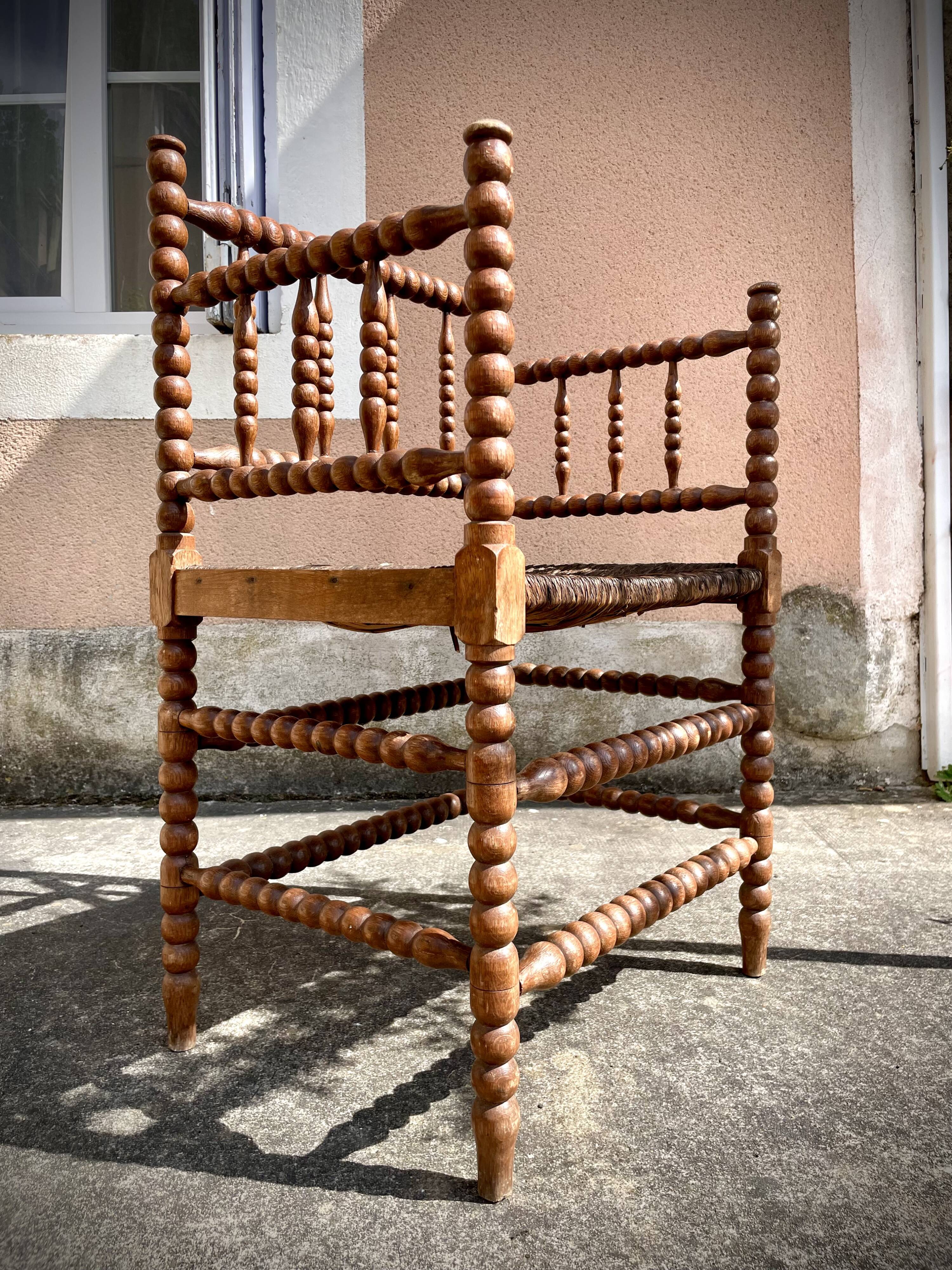 Antique Bobbin armchair with straw seat