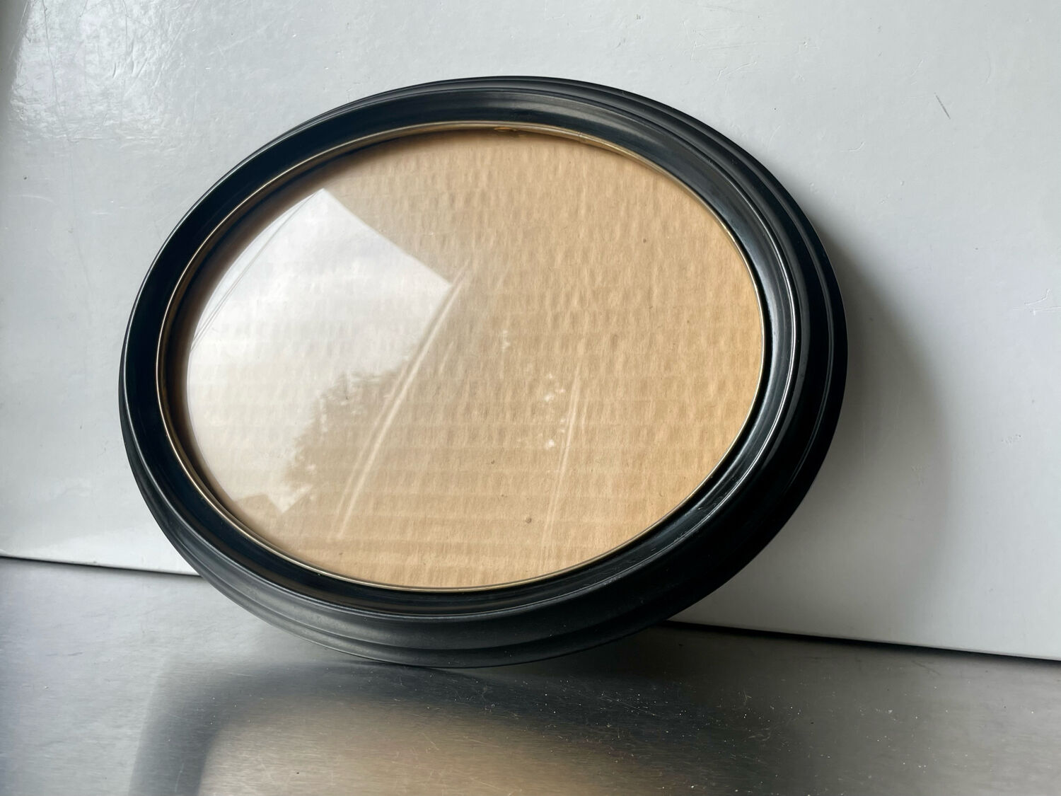 Oval bakelite black vintage frame with convex glass