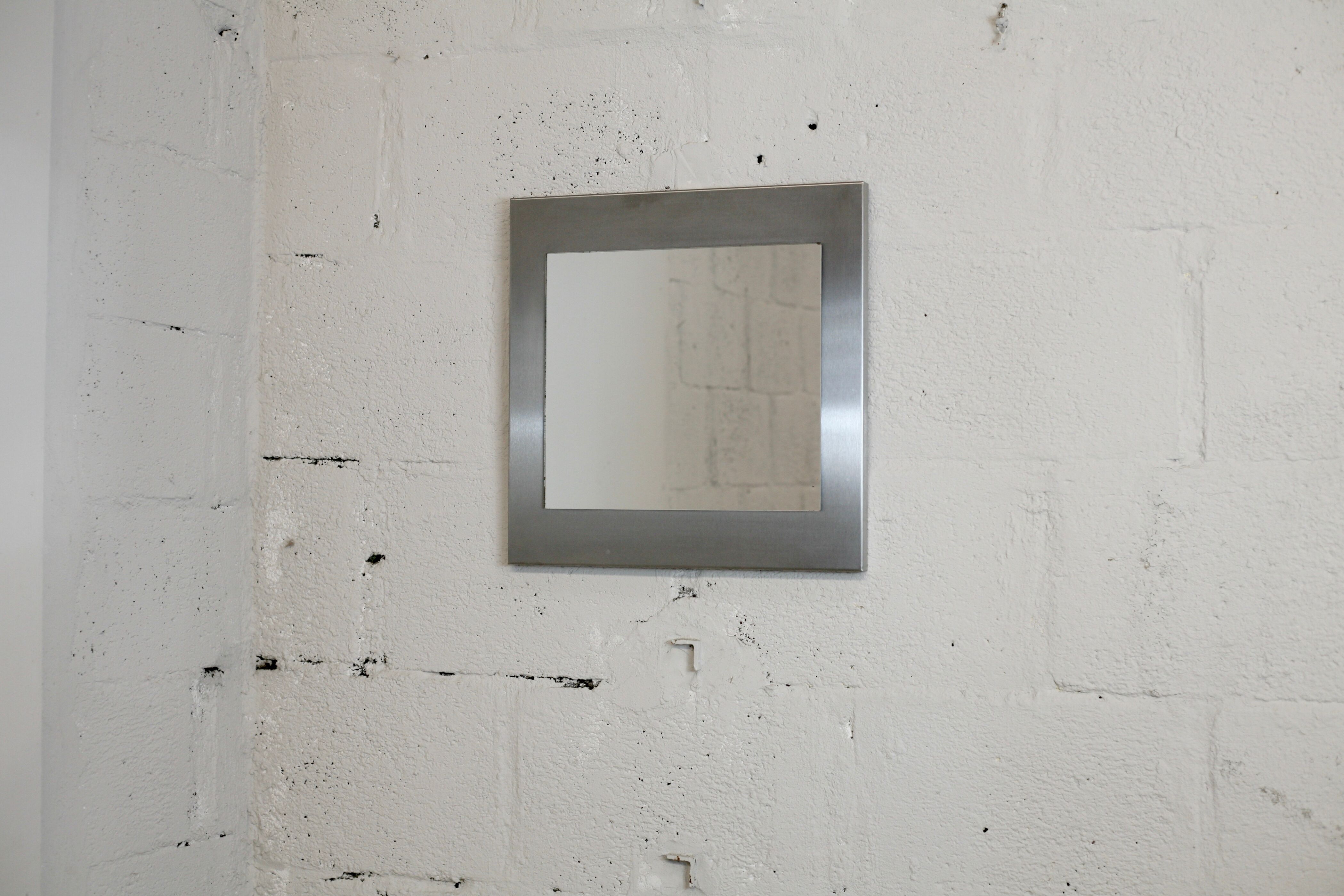 Mirror "space age". Stainless steel. France, circa 1970