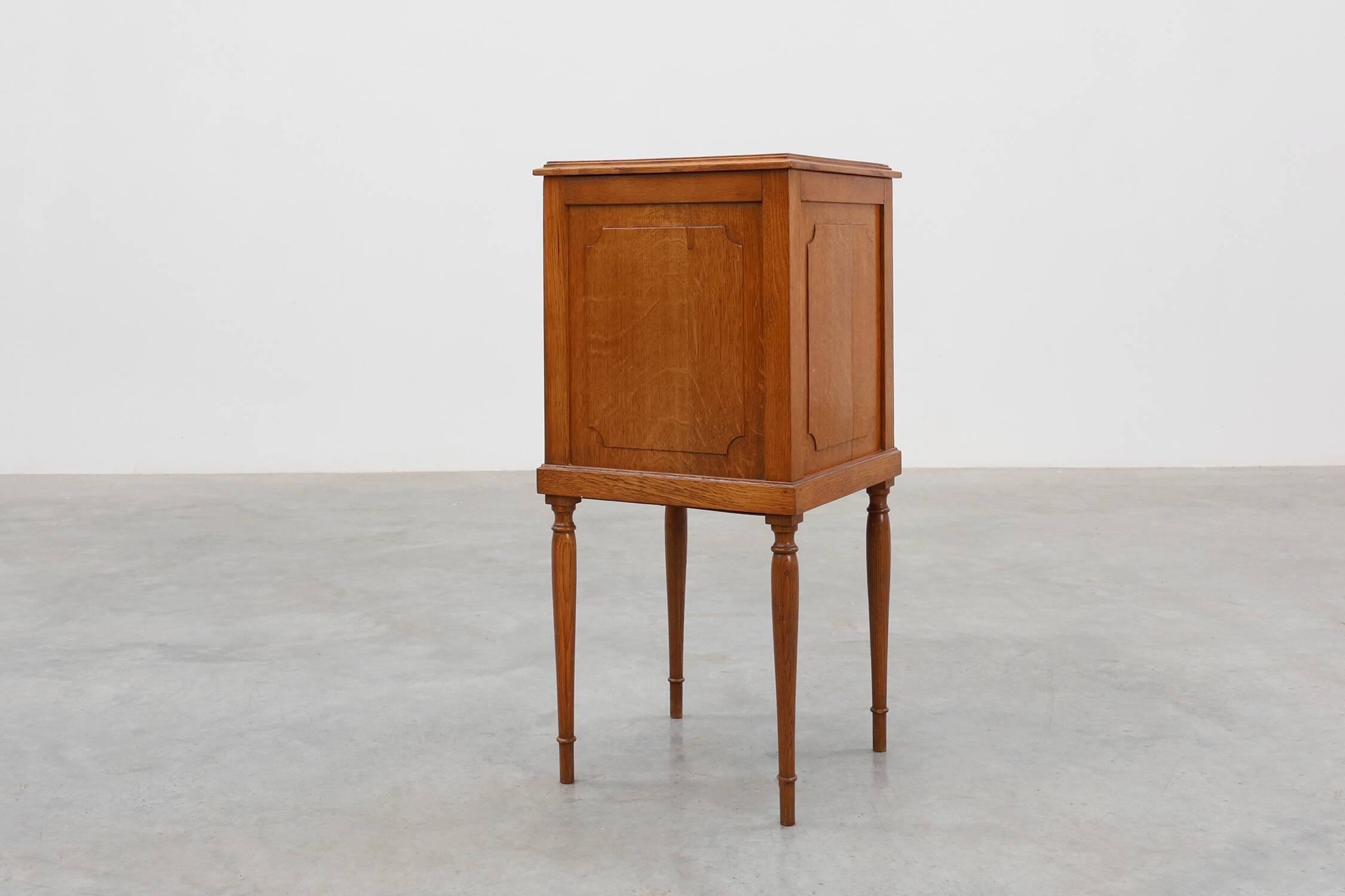 Art Deco nightstand in oak with turned legs, France 1920
