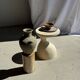 Light beige-grey Indonesian terracotta vase with 4 small handles and a high neck.