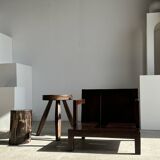 Small low armchair in varnished brown wood