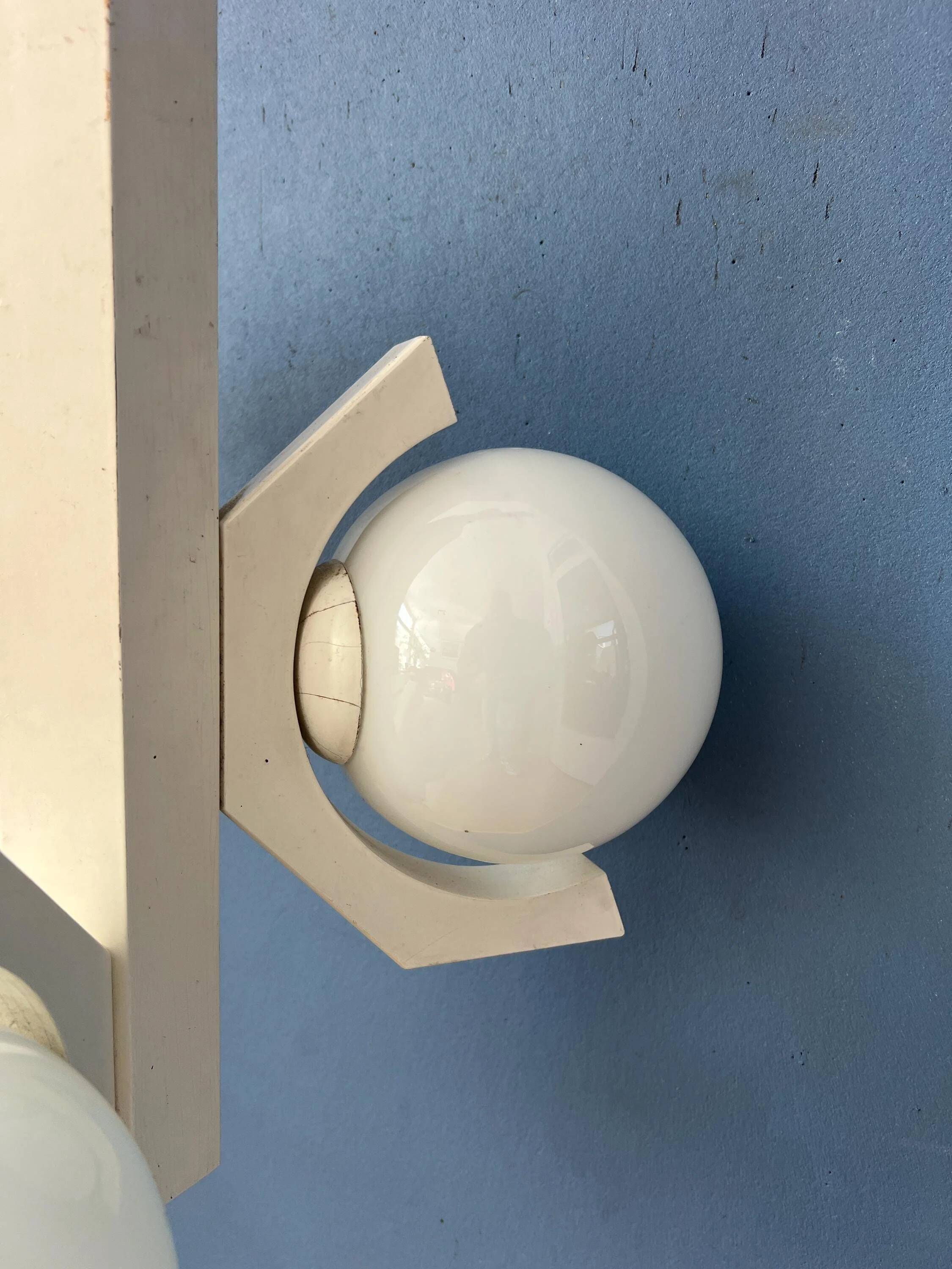 Mid-century white suspension with a bony design and opaline glass shade.