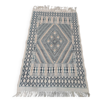 Handmade white, blue and beige rug made of natural wool