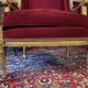 Golden wooden bergère in Louis XVI style upholstered in Bordeaux velvet.