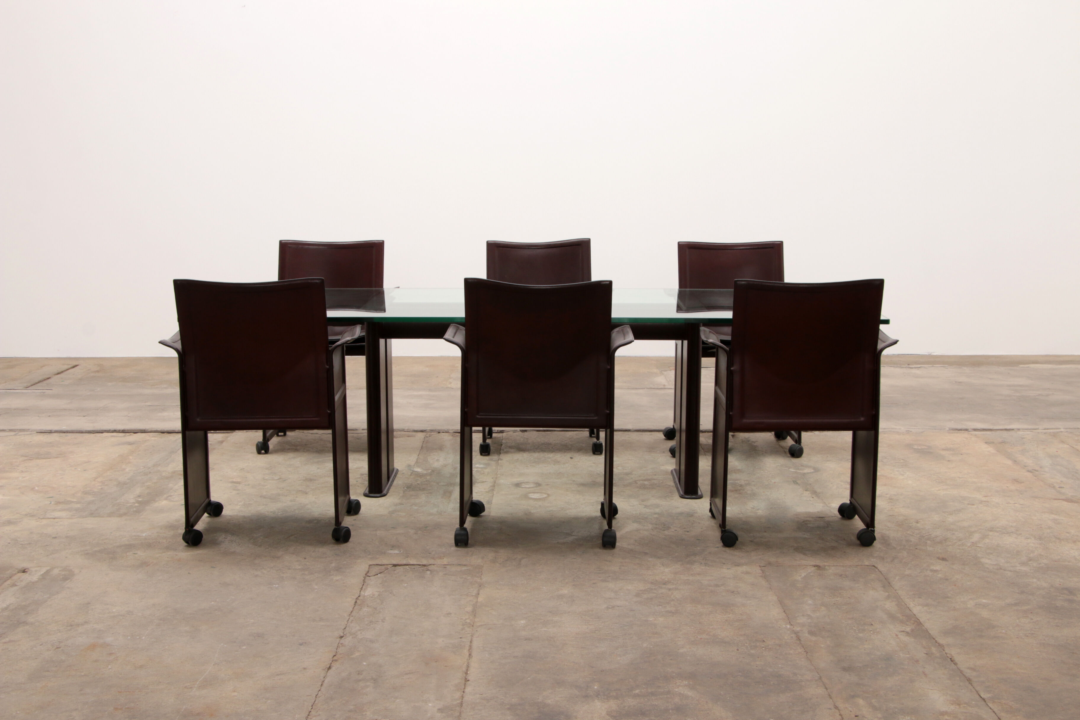 Tito Agnoli for Matteo Grassi leather dining table and six chairs