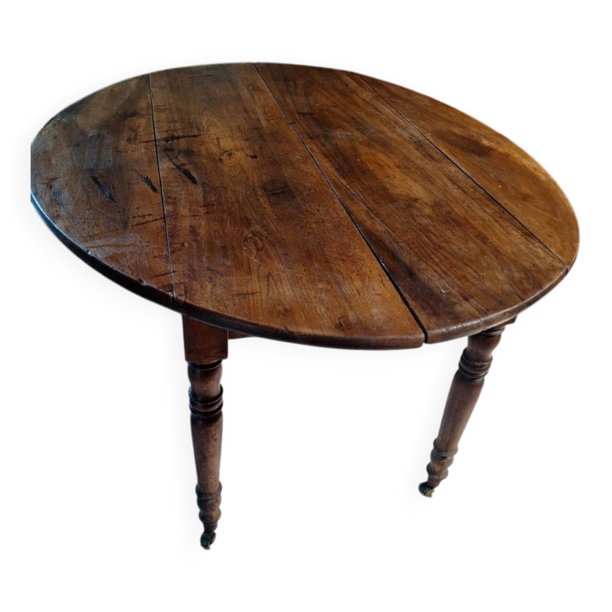 Oval table with folding leaves