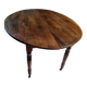 Oval table with folding leaves
