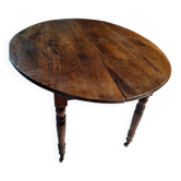 Oval table with folding leaves