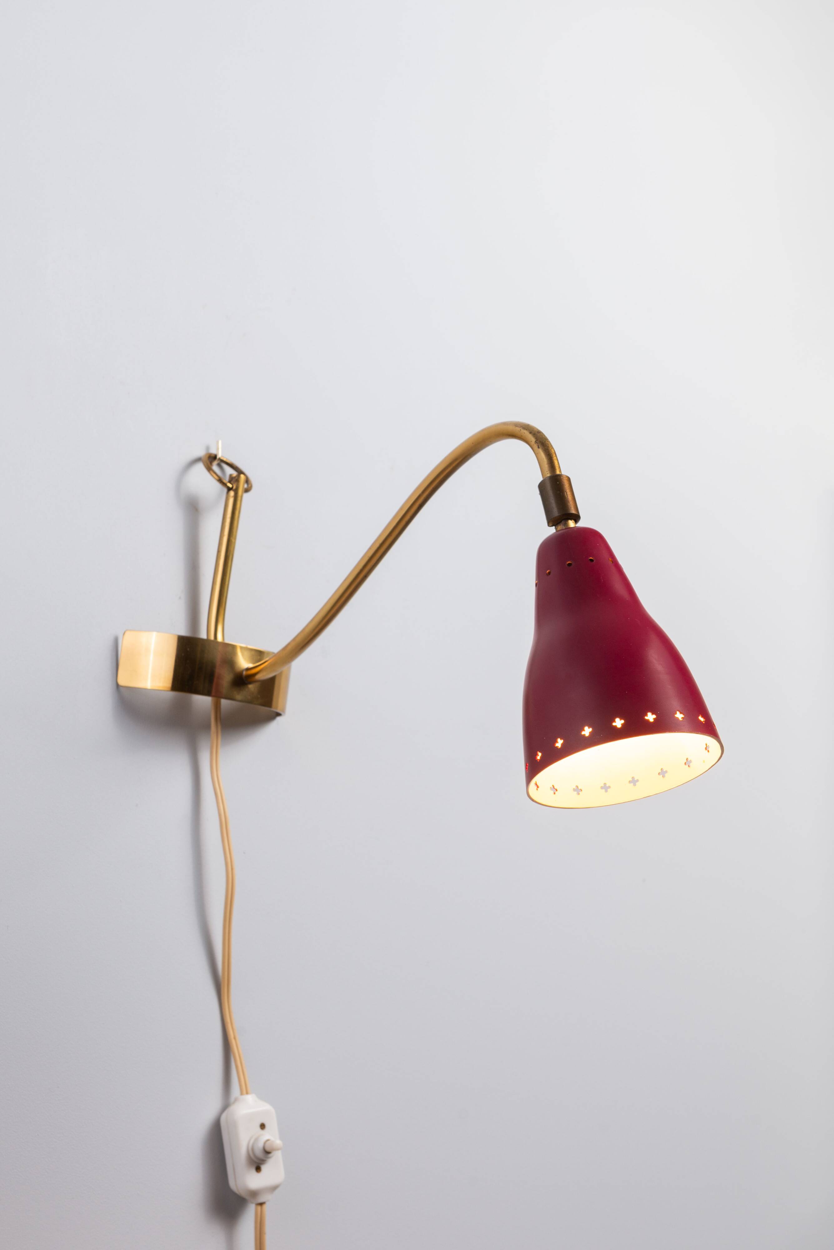 Brass wall lamp with perforated metal shade, 1950s, Sweden