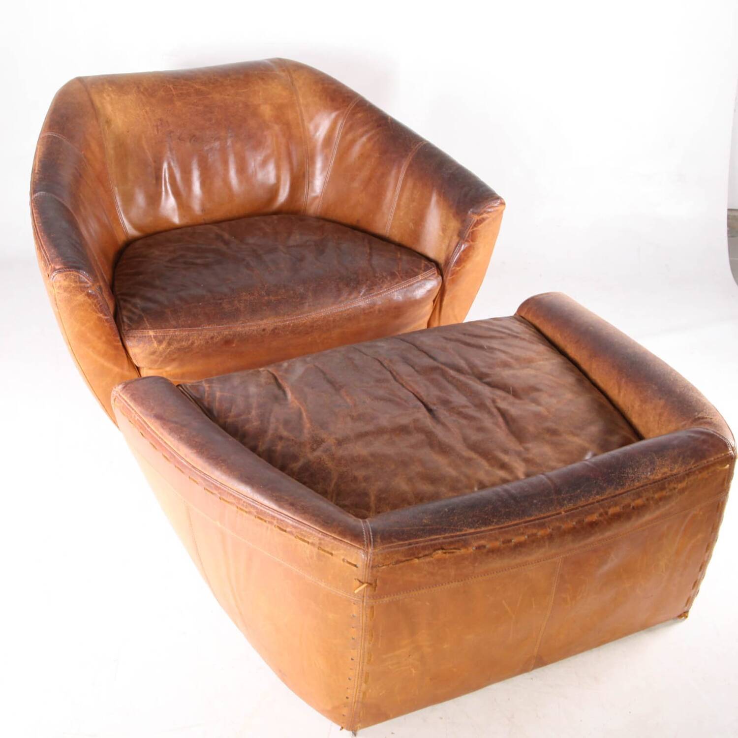 Grands fauteuil et ottoman en cuir