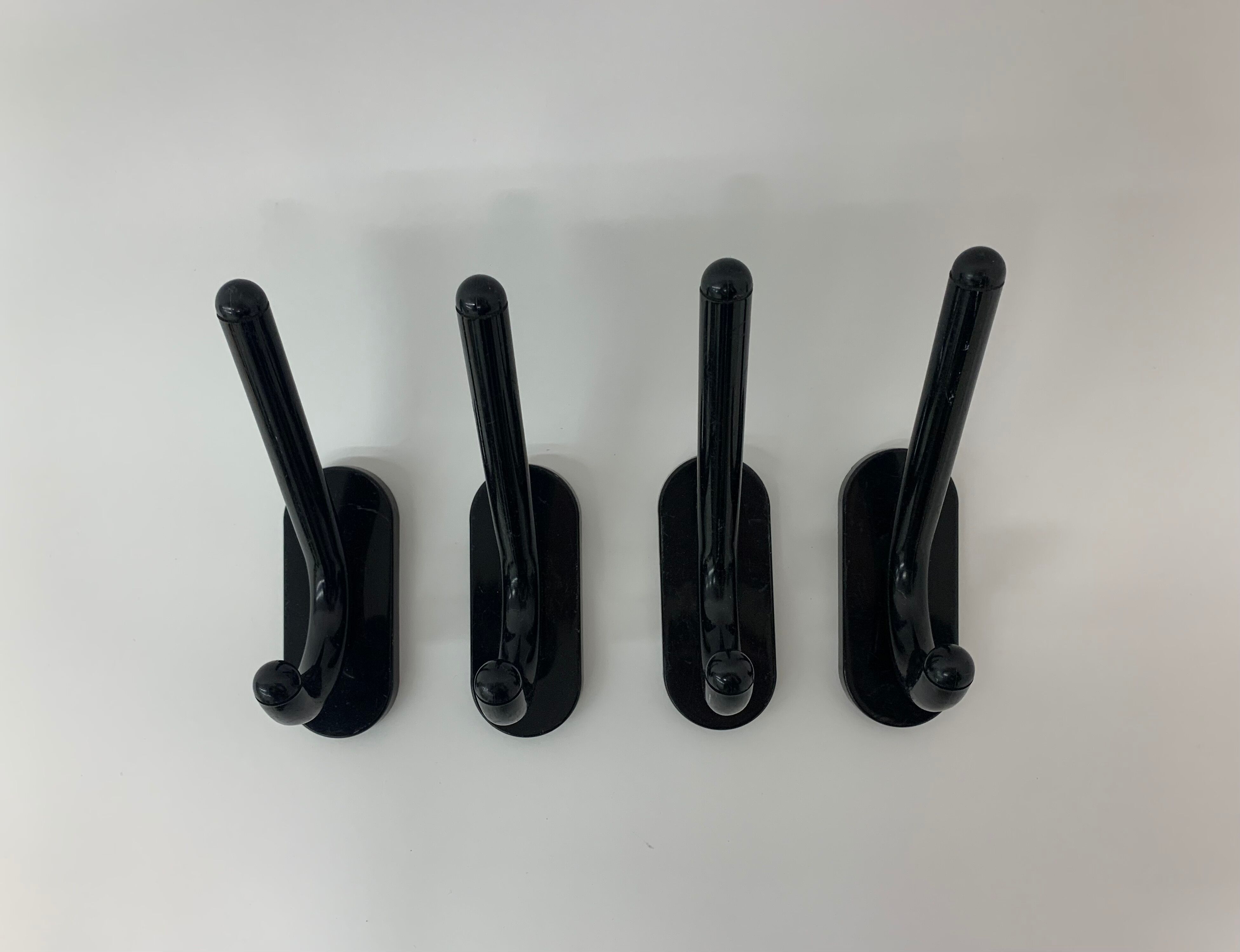 Set of 4 con & con Italian black wall coat / towel hangers , 1970’s