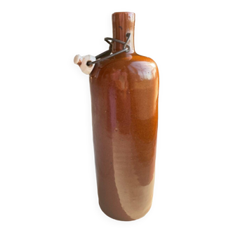 Old hot water bottle in glazed sandstone