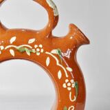 Circular glazed terracotta gargoulette