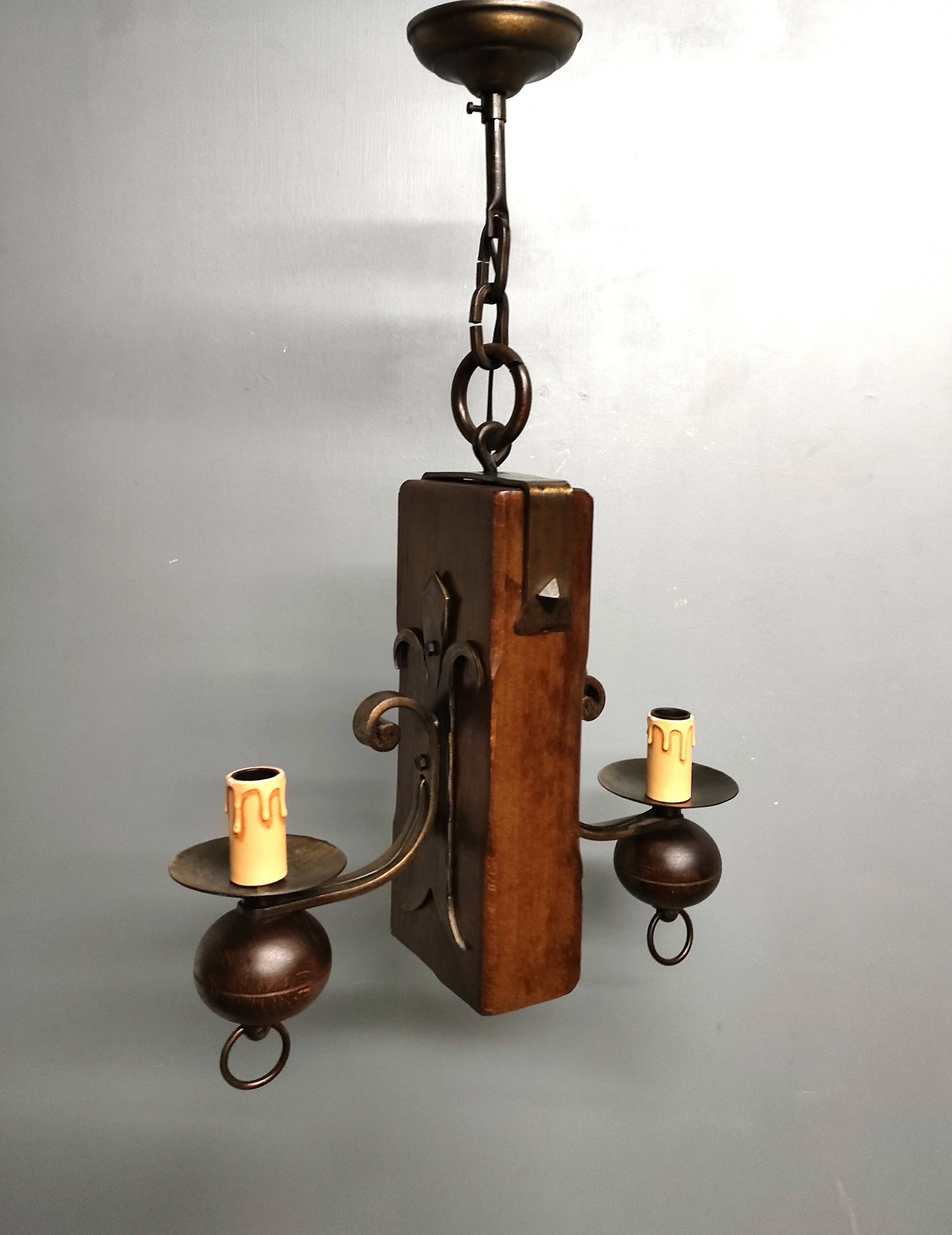 Medieval 2-light chandelier ~ hammered and patinated wrought iron ~ oak ~ 60s ~ France