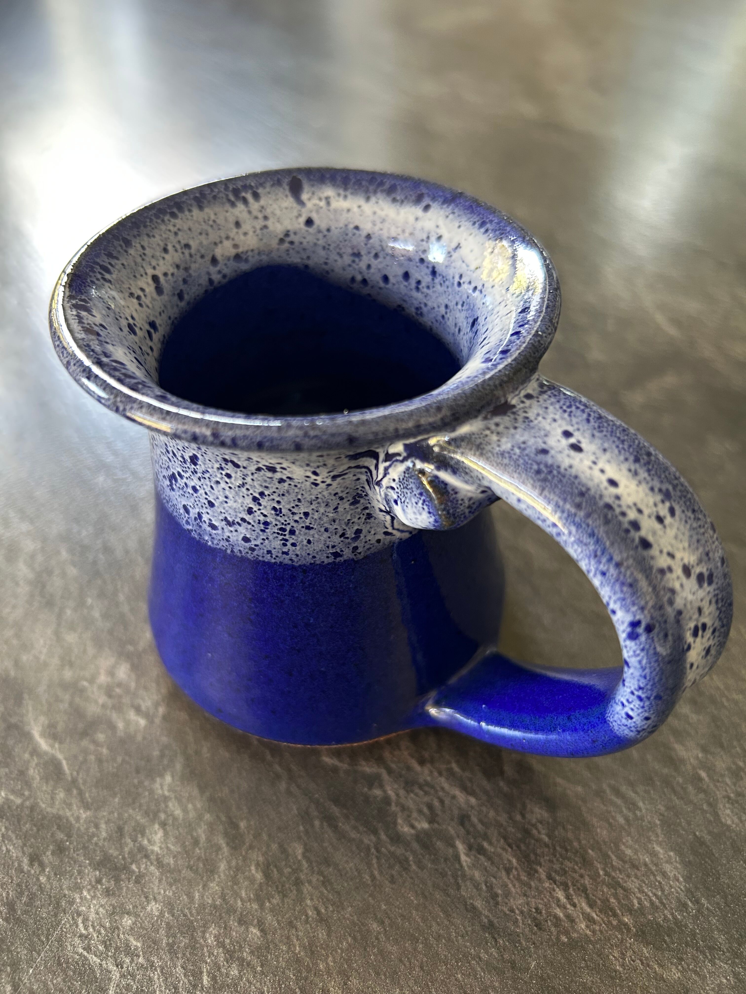 Small enamelled earthenware milk jug