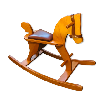 Honey-colored rocking wooden horse