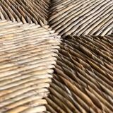 Dark brown solid wood Arts & Crafts armchair with natural rush seat and high back