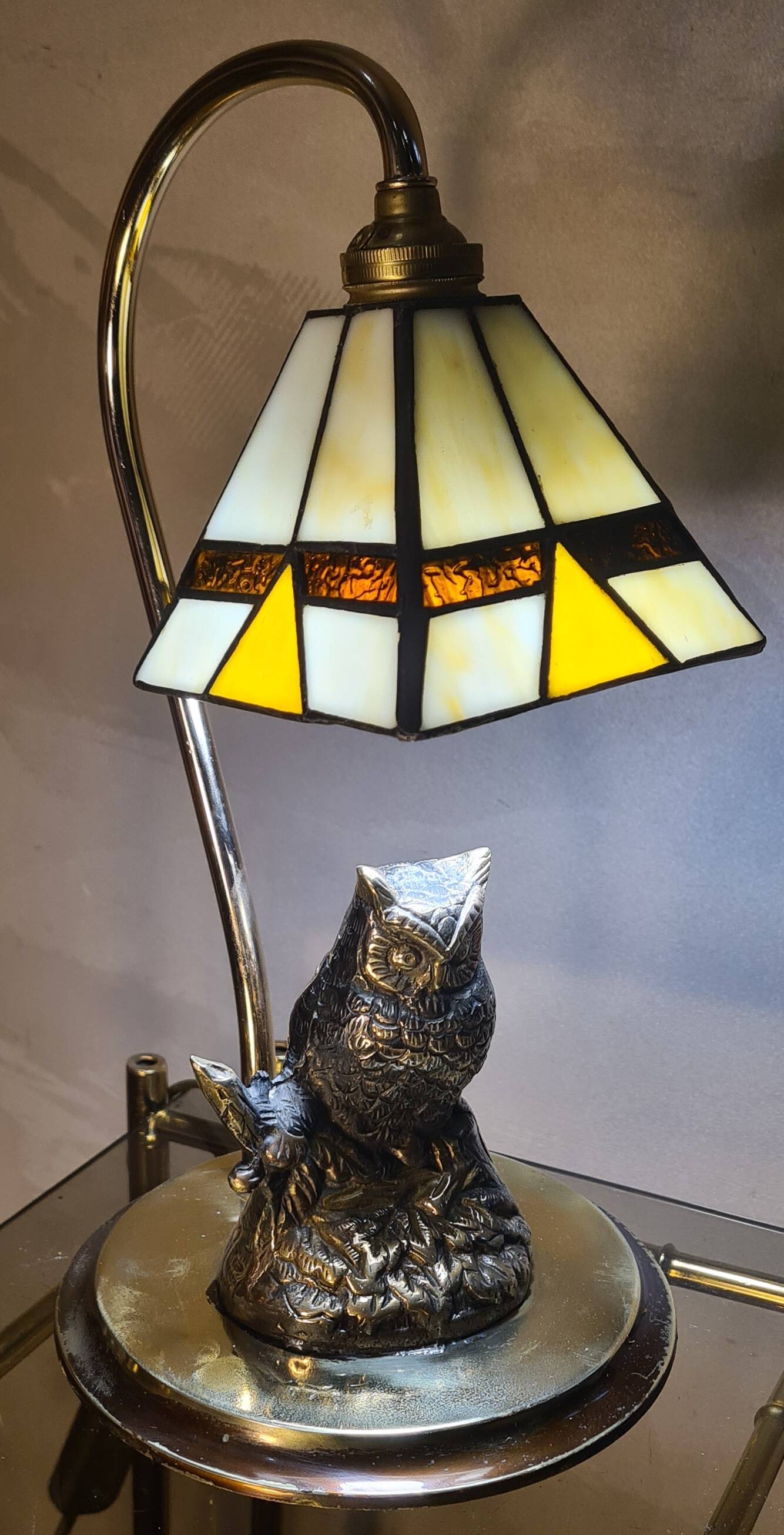 Owl-shaped designer bedside lamp, solid bronze owl with glass lampshade