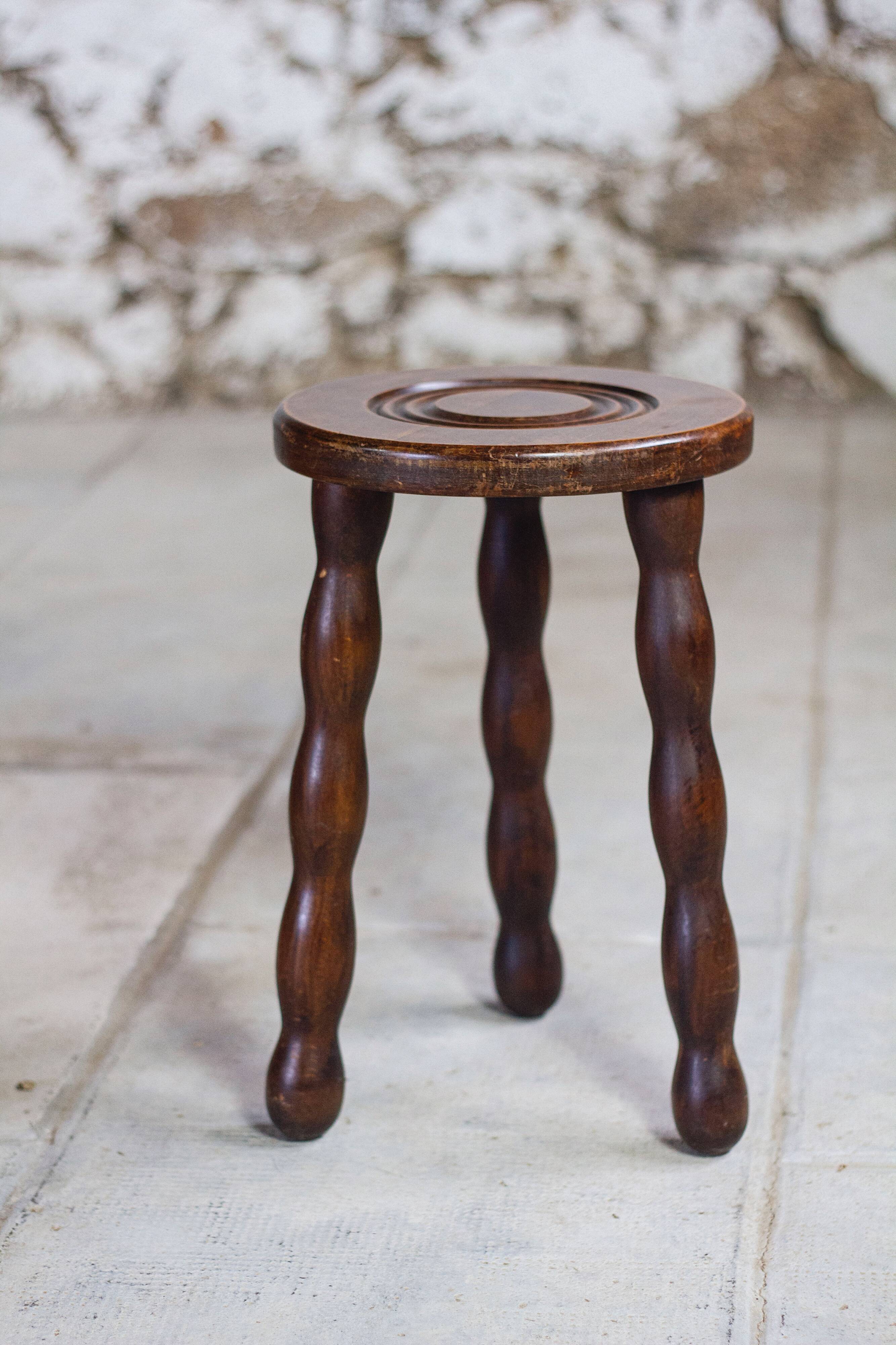 Tripod stool in turned wood in the style of Charles Dudouyt, 1950