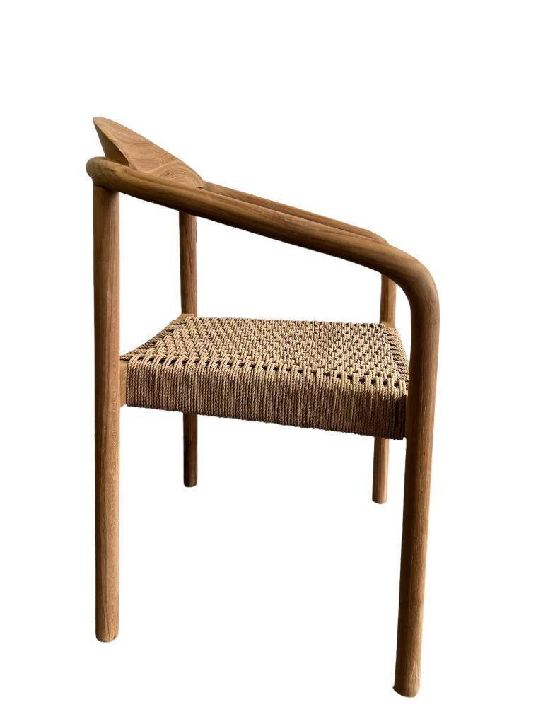 solid wood chair with woven seat and armrests