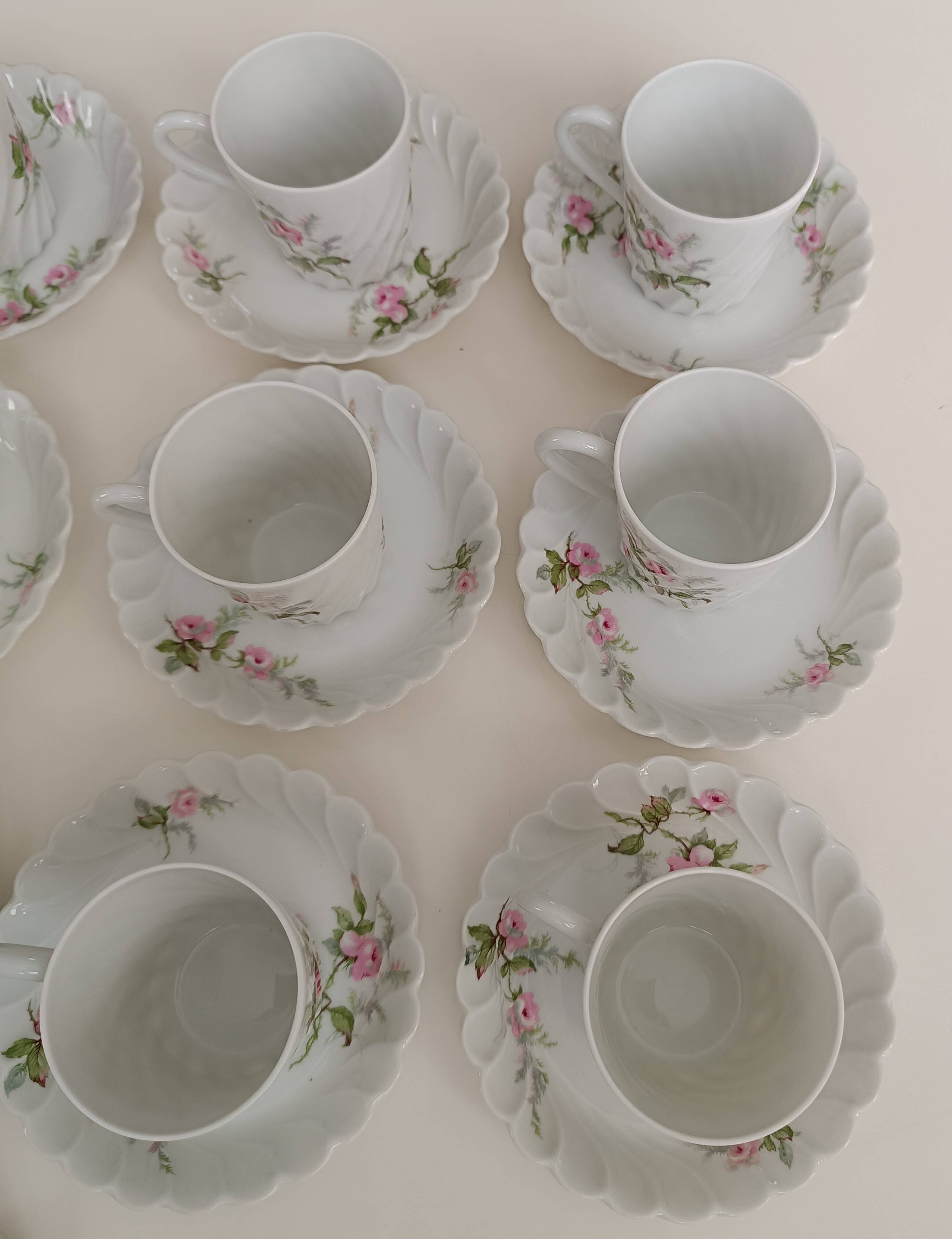 Haviland Limoges porcelain 10 coffee cups and 9 saucers with floral decoration.