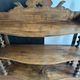 Antique wall shelf made of turned wood and spools of thread, late 19th century.