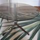 Round coffee table in smoked glass and chrome
