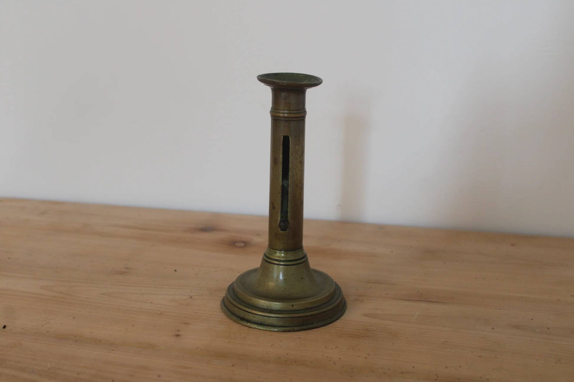 Antique brass push candle holder – vintage patinated candlestick H20 cm