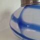 Old white and blue glass flower vase