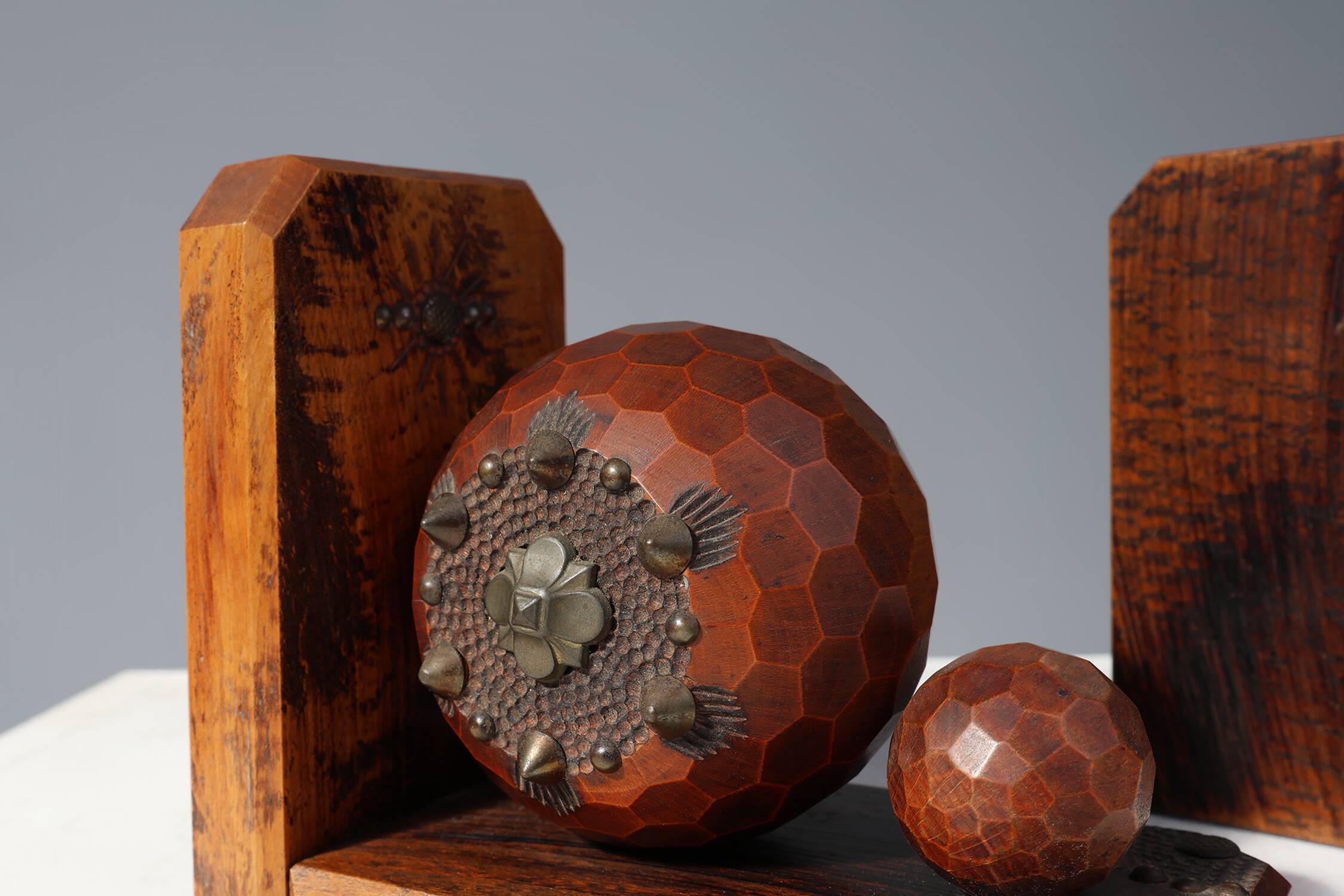 Pair of Art Deco faceted ball bookends in oak with metal decorations