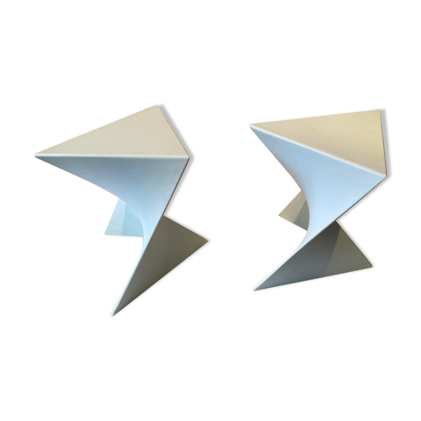 Pair of unmarked triangular white design stools