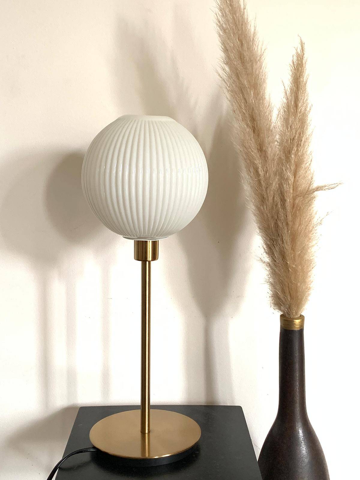 Table lamp with a lampshade from an old vintage pendant light in ribbed white glass and a pi