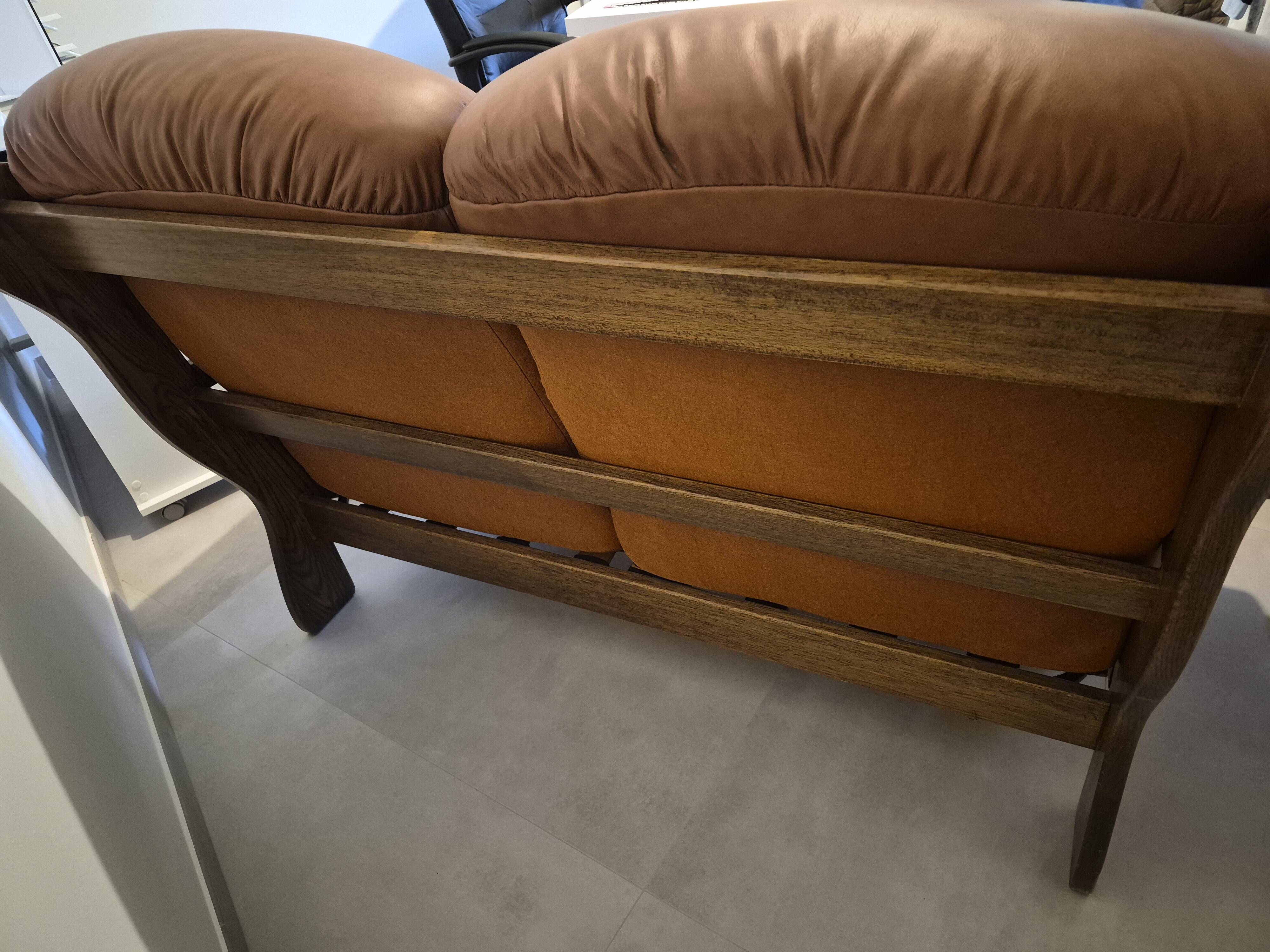 Vintage Scandinavian two-seater sofa in cognac leather and solid oak.
