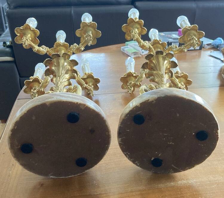 Pair of gilt bronze chandeliers, marble bases.