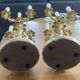 Pair of gilt bronze chandeliers, marble bases.