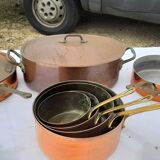 Lots of tinned copper kitchen utensils