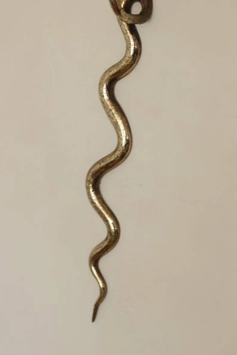 Pair of Neo-Egyptian Style Engraved Brass Wall Sconces Featuring Cobras
