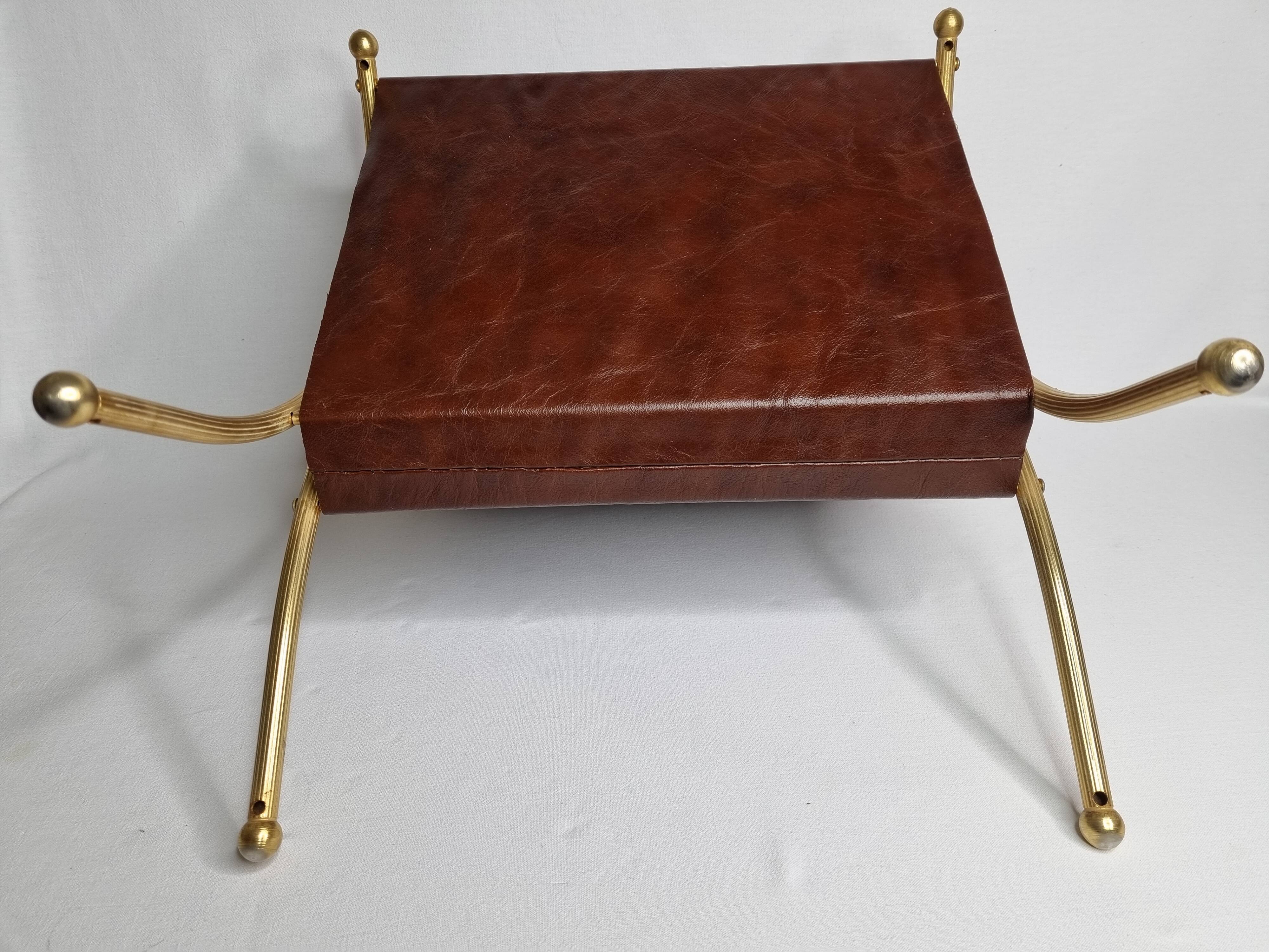 Vintage magazines and gold and leather brass