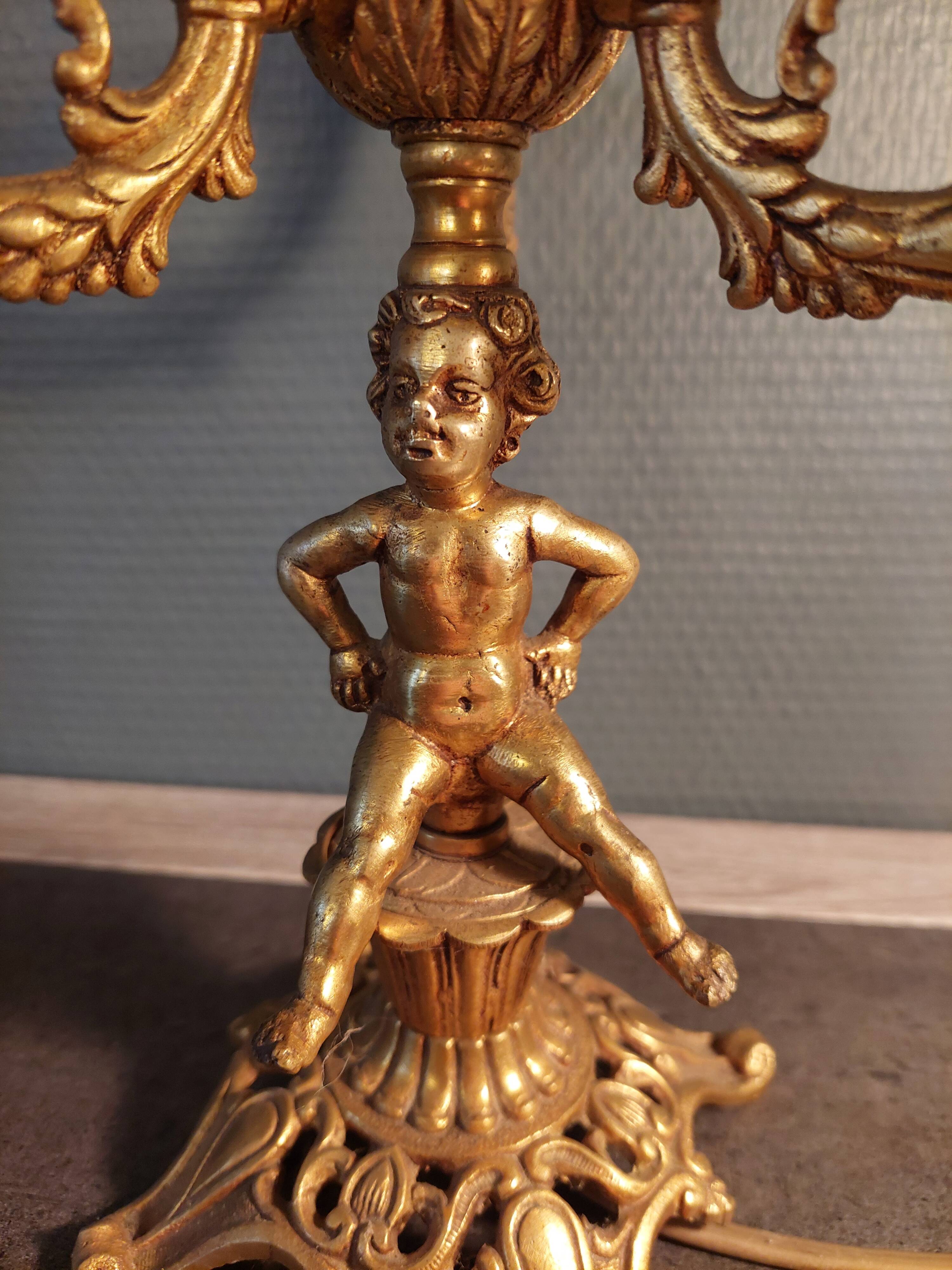 Electrified three-spoke brass candlesticks