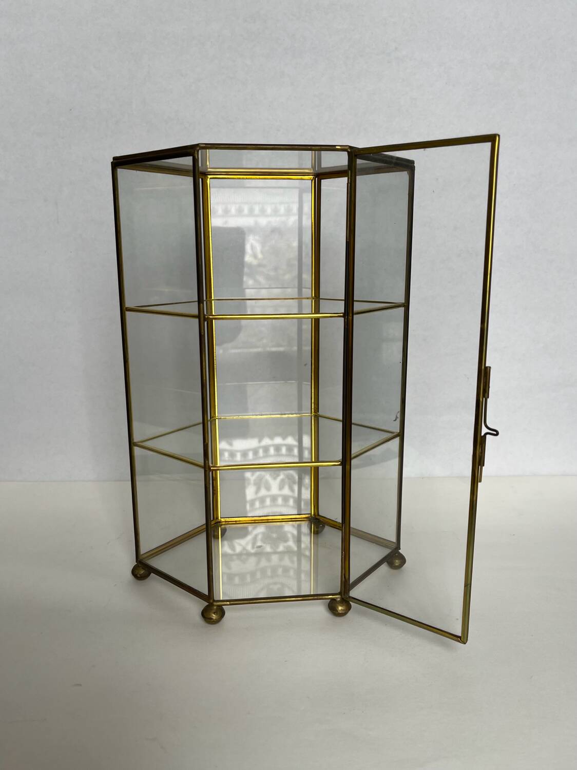 Small glass shelf on feet