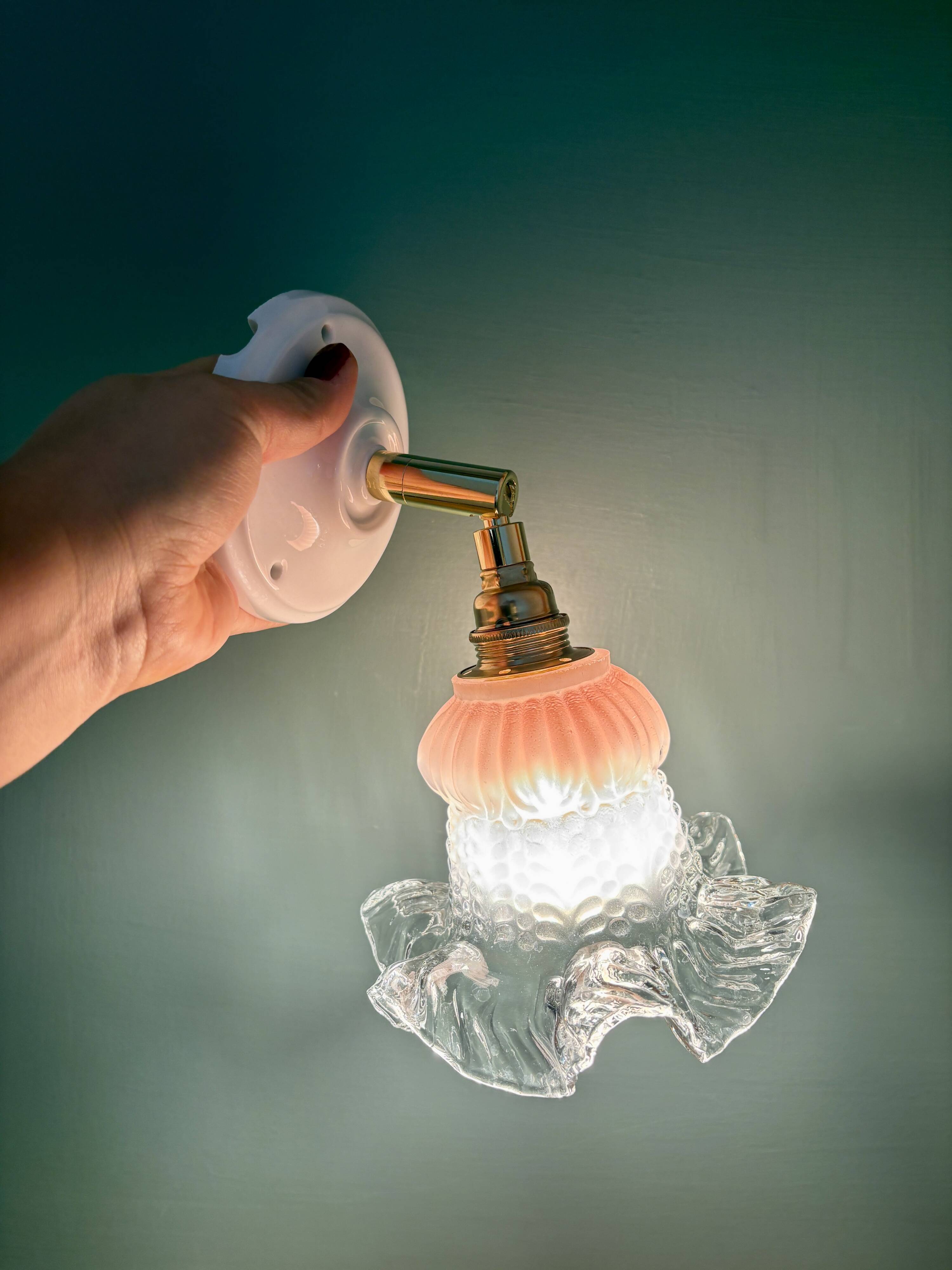 Vintage pink and clear glass tulip wall light.